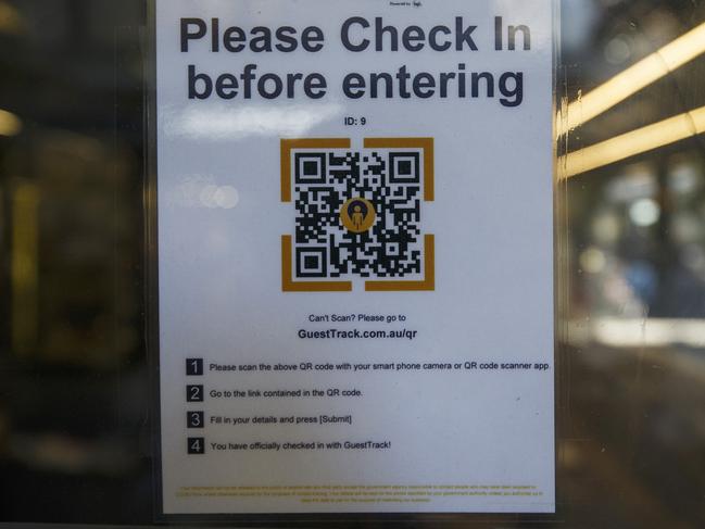 MELBOURNE, AUSTRALIA - MAY 12: A check in QR code is seen displayed on a restaurant window on May 12, 2021 in Melbourne, Australia. Victoria has recorded no further cases of coronavirus in the past day, after a man aged in his 30s tested positive for COVID-19 on Tuesday. The man in his 30s recently returned from overseas and completed mandatory hotel quarantine in SA before returning to Melbourne on 4 May. It is thought he contracted the virus in quarantine. (Photo by Daniel Pockett/Getty Images)