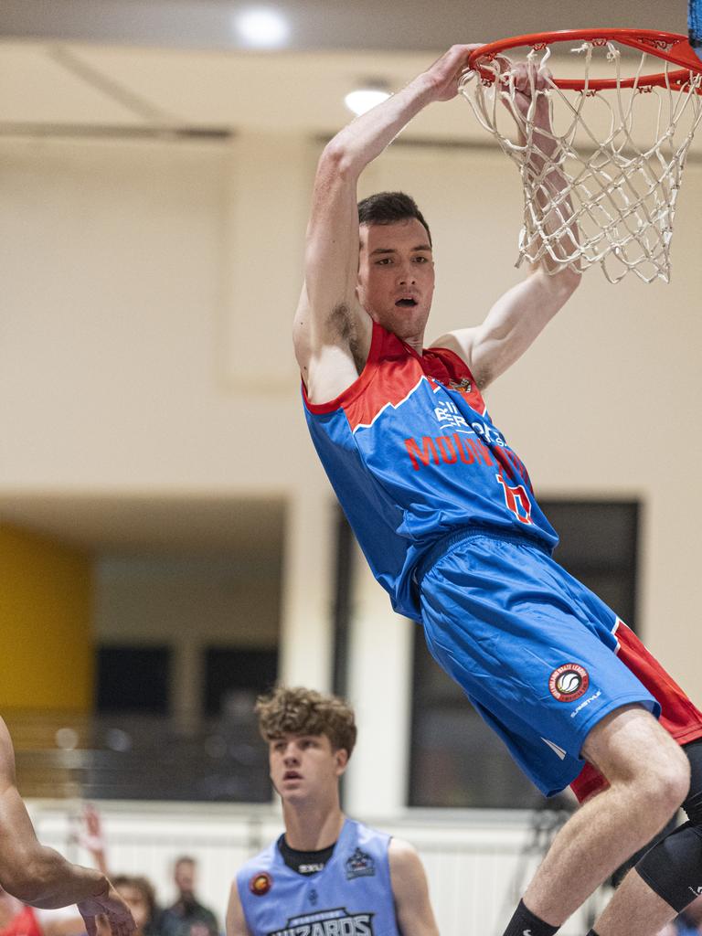 Patrick Roche dunks for Toowoomba Mountaineers against Northside Wizards in QSL Division 1 Men round 2 basketball at Clive Berghofer Arena, St Mary's College, Sunday, April 21, 2024. Picture: Kevin Farmer