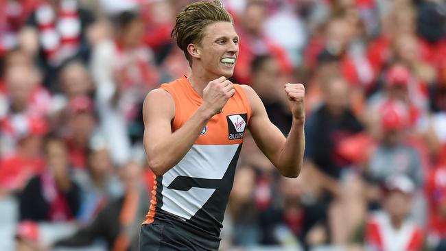 Lachie Whitfield celebrates after kicking a goal against Sydney.