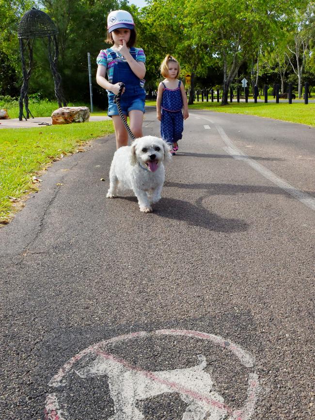 Millie Liddell and Eleanor Liddell walk their dog Penfold at East Point Reserve in Fannie Bay. PICTURE: Elise Derwin