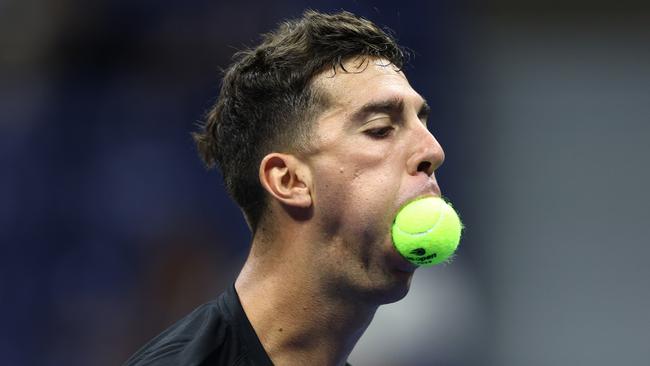 Thanasi Kokkinakis of Australia reacts against Nick Kyrgios