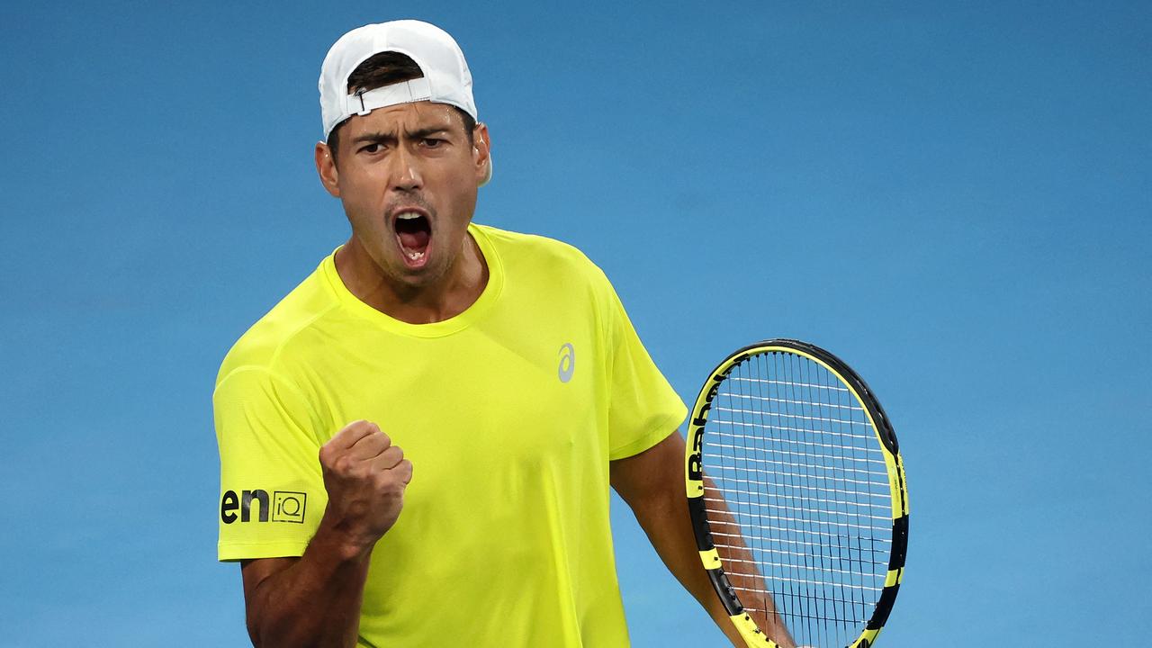 Australia's Jason Kubler celebrates his first set against Britain's Daniel Evans during their menâ&#128;&#153;s singles match of the United Cup tennis tournament in Sydney on December 30, 2022. (Photo by DAVID GRAY / AFP) / -- IMAGE RESTRICTED TO EDITORIAL USE - STRICTLY NO COMMERCIAL USE --