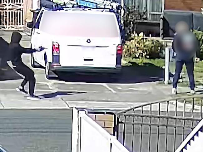 Terrifying footage has captured the moment a man was shot in a street in Melbourne’s north after he was allegedly lured there under work pretenses. Emergency services were called to Denys St in Fawkner following reports a man had been shot about 9.30am on October 3 last year. CCTV captured a white Mercedes Benz travelling on the streeet about 25 minutes earlier, travelling all the way around a roundabout before parking on the street.The 49-year-old victim arrived just after 9.30am. Investigators believe he was lured to the address under the pretence of giving a quote for a trades job. Picture: Victoria Police.