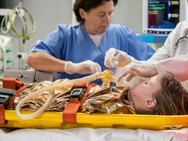 Doctors Using Oxygen Mask On Patient in emergency department - picture istock