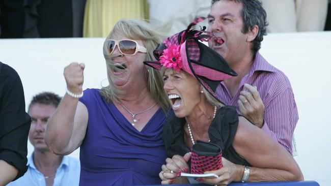 Trainer Gillian Heinrich watches as winning horse Military Rose take out the Cup.