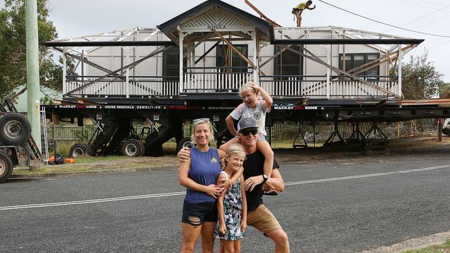 Bianca and Glen Wakelin with daughters Kayla, 9, and Ava, 6, standing in front of their newly moved house. Photo: supplied