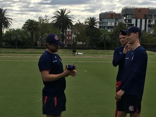 Chris Anderson receives his First XI cap from Jack Harper.