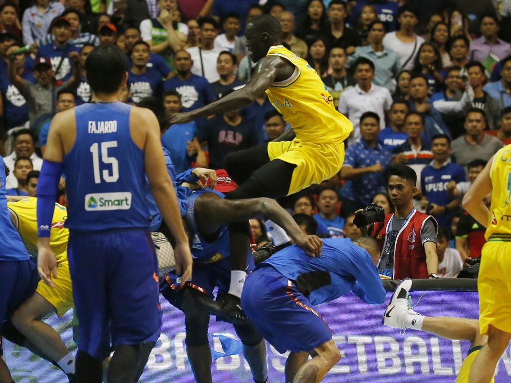 The Philippines and Australian basketball players react, during the FIBA World Cup Qualifiers Monday, July 2, 2018 at the Philippine Arena in suburban Bocaue township, Bulacan province north of Manila, Philippines. Australia defeated the Philippines 89-53 via default following a brawl in the third quarter. (AP Photo/Bullit Marquez)