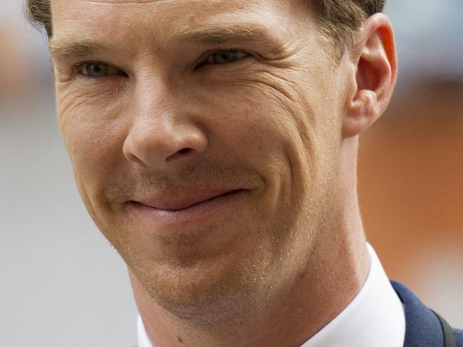 Actor Benedict Cumberbatch poses for photographs on the red carpet for the new movie "The Imitation Game" during the 2014 Toronto International Film Festival in Toronto on Tuesday, Sept. 9, 2014. (AP Photo/The Canadian Press, Nathan Denette)