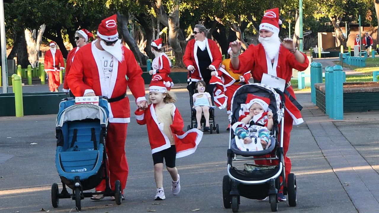 Families take part in the Darwin Santa Fun Run in July at Mindil Beach. Picture Katrina Bridgeford