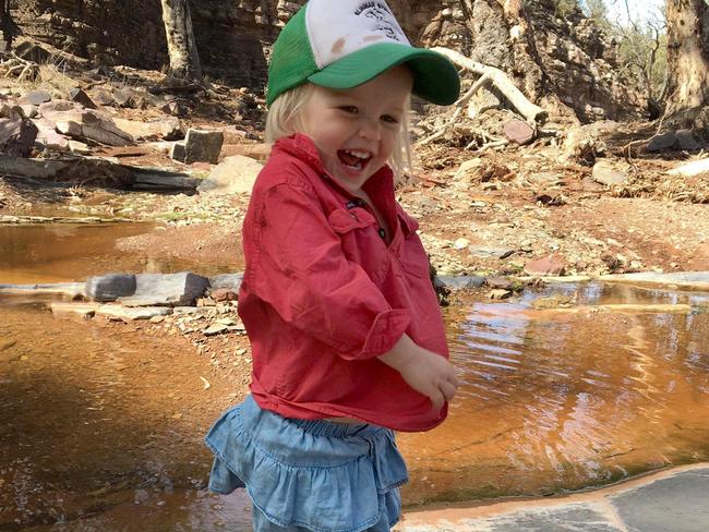 Eloise Fargher Carmichael, 2, at Angorichina Station, north of Flinders Ranges, after the rain overnight. They received 26mm. Picture: Alice Fargher