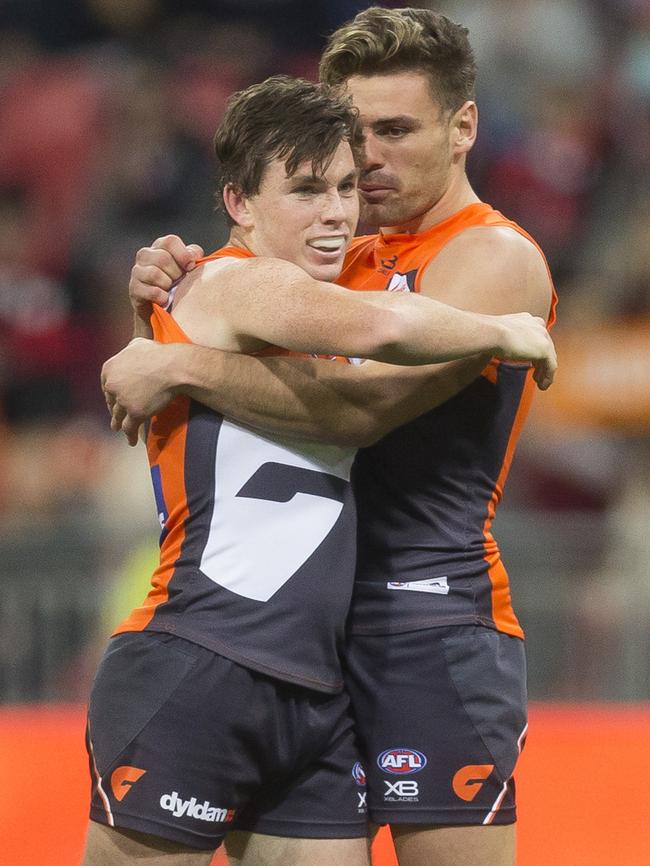 Brent Daniels and Stephen Coniglio celebrate a goal.