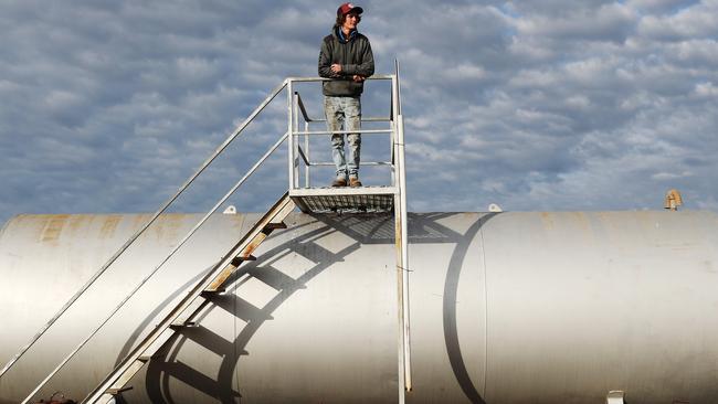 With diesel prices sky rocketing, farm hand Jackson Rankmore checks the fuel levels at the end of the cotton harvest on the Liverpool Plains. Picture: Peter Lorimer