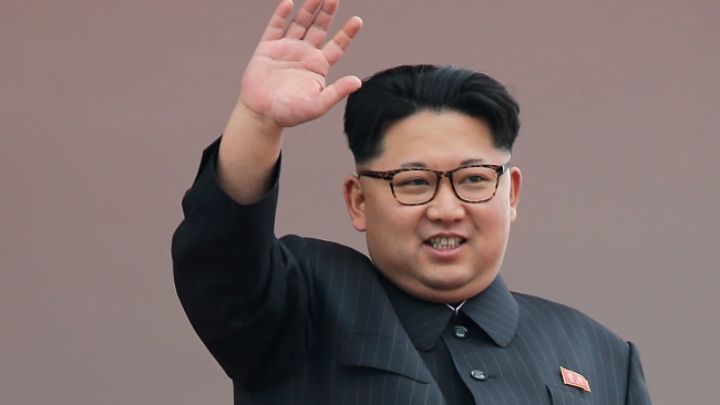 North Korean leader Kim Jong Un waves at parade participants. Picture: AP.