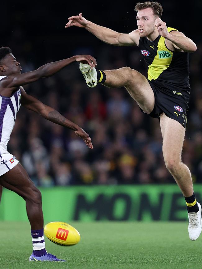 Noah Balta’s kick is smothered after the umpire called play on after he exceeded his 30 seconds to take his shot. Picture: Mark Stewart