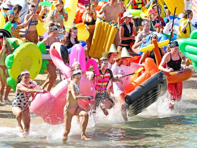 They're off & racing as more than 750 people dressed in crazy costumes and inflatable boats to compete in the annual Manly Inflatable Boat Race, at Shelly Beach, on Sydney's Northern Beaches. Picture: Troy Snook
