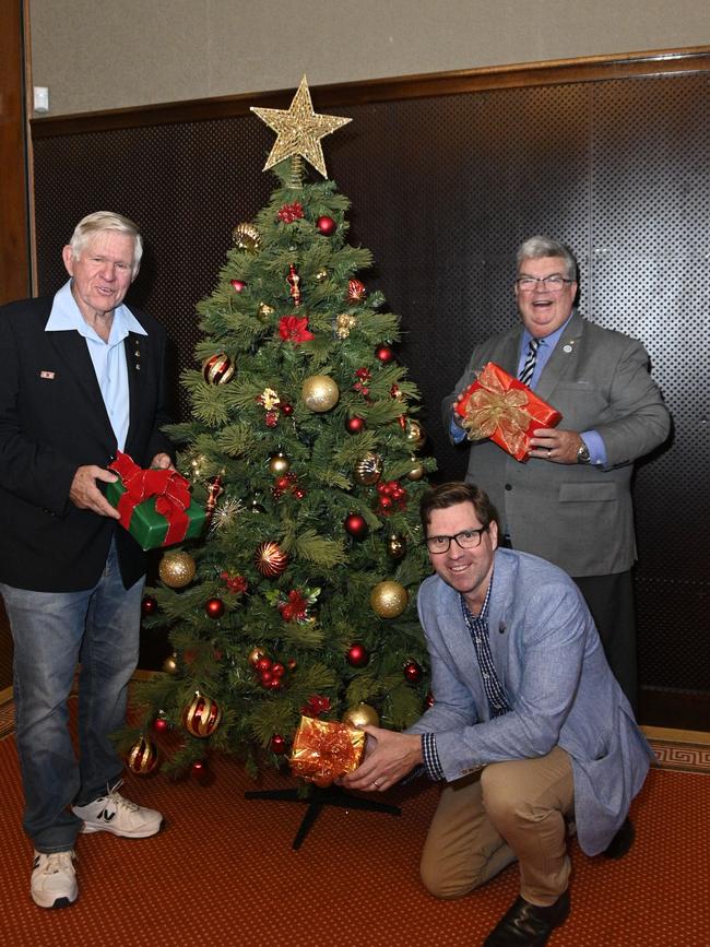 Toowoomba Christmas Wonderland was cancelled due to Covid-19 restrictions in 2020. From left; Marshall Cox from the Lions Club Toowoomba West, Derek Tuffield Lifeline CEO and (front right) TRC deputy mayor Geoff McDonald.