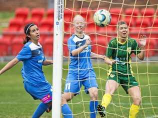 AT THE DOUBLE: Thunder striker Louise Rolfe scores one of her two goals against Mitchelton. The Thunder women lost the match 3-2. Picture: Nev Madsen