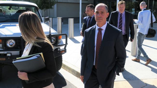 Former AFP deputy commissioner Ramzi Jabbour leaves the ACT Magistrates Court after being cleared of dishonesty and firearms charges. Picture: Craig Dunlop