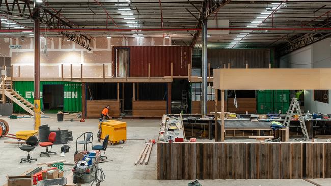 A VIP-area of shipping containers looks out over the central main bar.