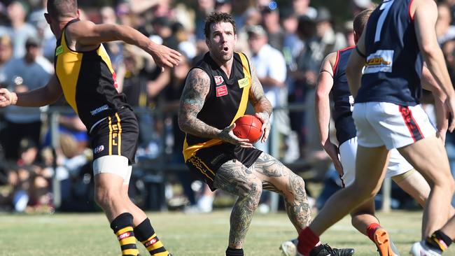 Dane Swan gathers one of his 24 possessions. Picture: Lawrence Pinder