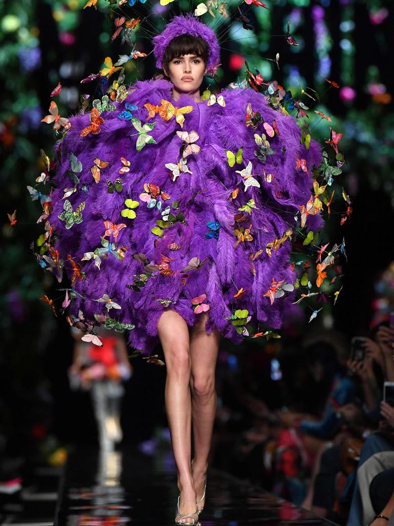 The show climaxed with a model in a furry purple orb that was mobbed by a cloud of butterflies -- a look that drew spontaneous applause from the crowd. Picture: AFP