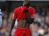 Liverpool's Italian striker Mario Balotelli reacts during the English Premier League football match between Queens Park Rangers and Liverpool at Loftus Road in London on October 19, 2014. AFP PHOTO / ADRIAN DENNIS RESTRICTED TO EDITORIAL USE. No use with unauthorized audio, video, data, fixture lists, club/league logos or “live” services. Online in-match use limited to 45 images, no video emulation. No use in betting, games or single club/league/player publications.