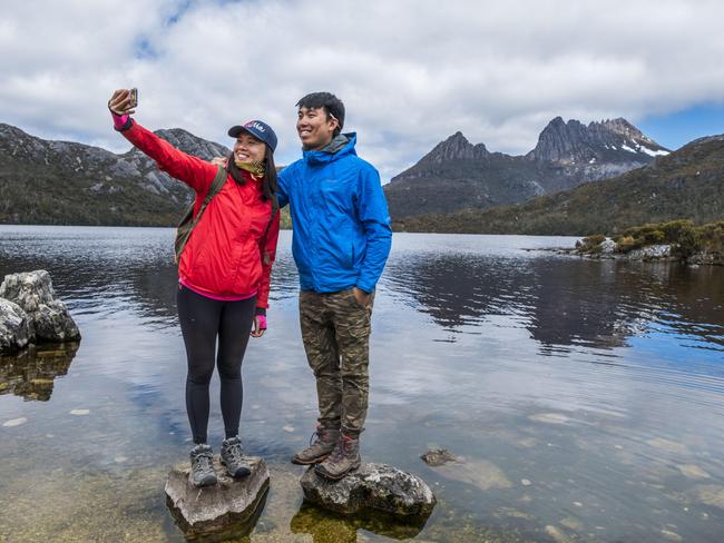 Kate Cheung and Allen Lee, from Hong Kong, are among the surging numbers of tourists visiting the state’s national parks. Picture: CHRIS CRERAR