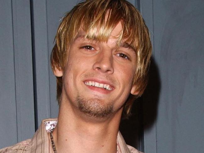 (FILES) In this file photo taken on June 20, 2006, singer Aaron Carter arrives at the T-Mobile Sidekick 3 party held on Sunset boulevard in Hollywood. - Singer Aaron Carter has been found dead at his house in Lancaster, California, according to media reports. He was 34. TMZ reported law enforcement sources as saying they received a 911 call at 11 a.m. Saturday about a male who had drowned in the bathtub. Multiple sources also told TMZ Saturday that the  singerâs body was found in his bathtub. (Photo by Chris Delmas / AFP)