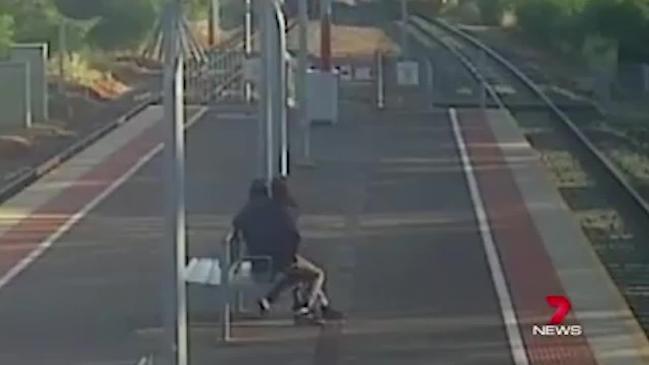 Lucas Narkle drags girlfriend towards train (7 News Adelaide)