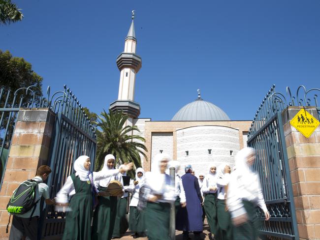 Students outside Malek Fahd Islamic School in Greenacre. The school might not reopen for Term 3.