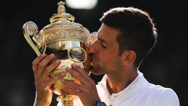 Serbia’s Novak Djokovic kisses the trophy after defeating Australia’s Nick Kyrgios in the Wimbledon men’s singles final. Picture: AFP