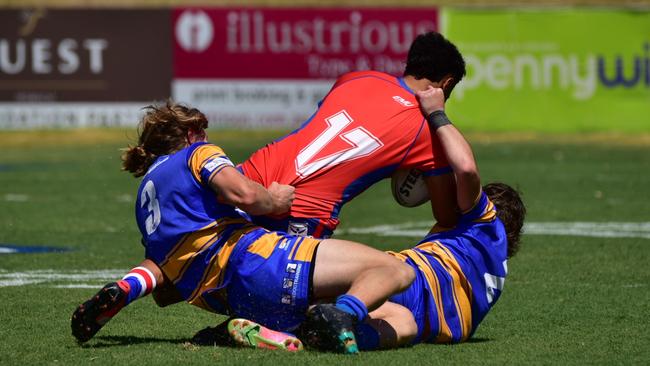 The Norths Tigers tacklers try to stop the Redbank Plains attacker during the Rugby League Ipswich Colts grand final. Picture: Bruce Clayton