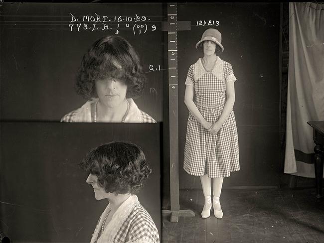 Dorothy Mort hides her face under a fringe for mugshots taken just before her release from Long Bay.