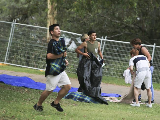 Crowds flock into Mrs Macquarie's Chair to claim positions for tonight's New Years Eve celebrations in Sydney. Picture: Dylan Robinson