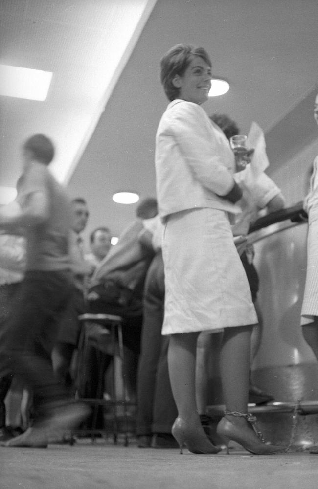 Women in 1965 had to chain themselves to the footrail in the public bar of the Regatta Hotel to drawing attention to their campaign to give women the right to drink side-by-side with men in public bars. Picture: Bruce Postle