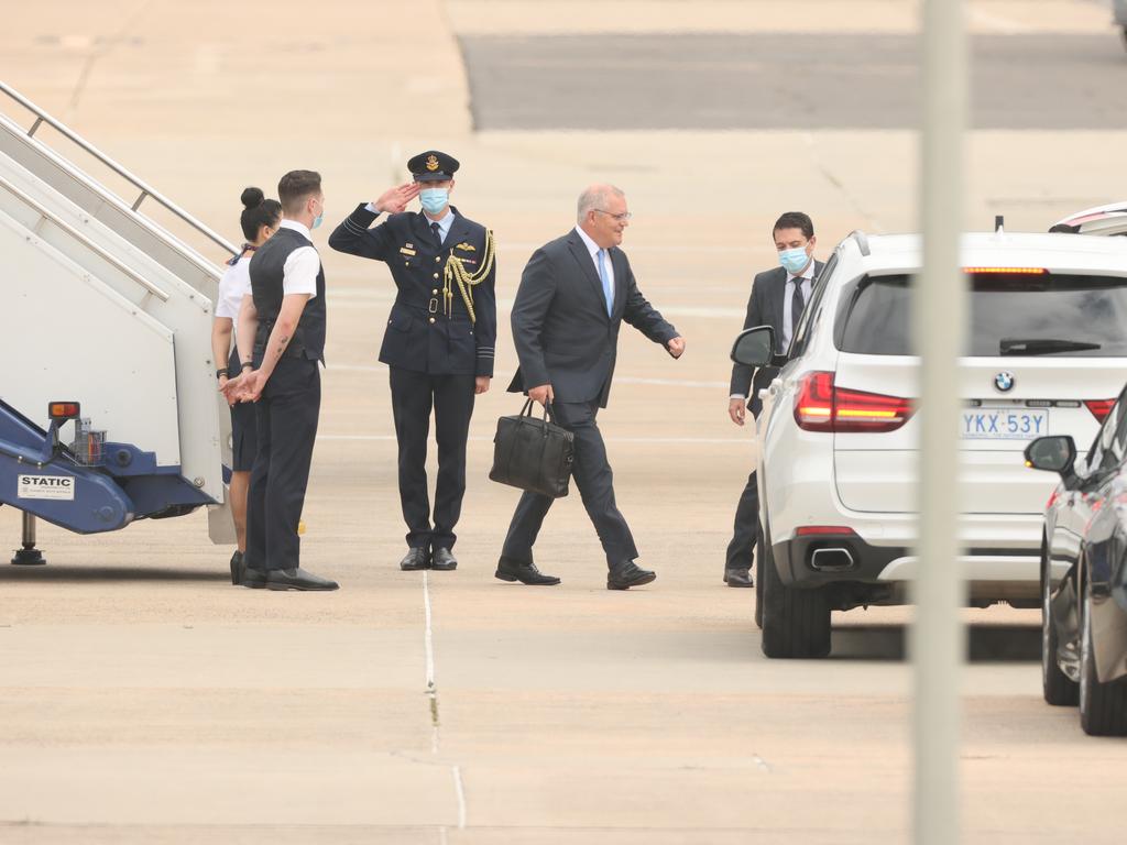 Mr Morrison touched down in Canberra before 10am on Sunday. Picture: Jason Edwards