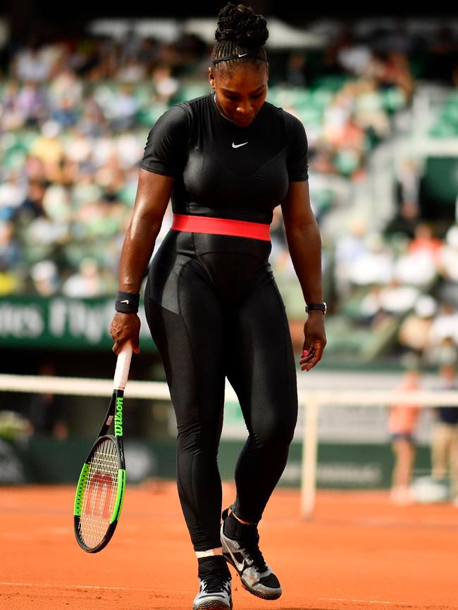 Serena Williams on court in her suit.