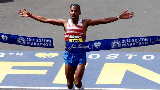 BOSTON, MA - APRIL 21: Meb Keflezighi of the United States crosses the finish line to win the 118th Boston Marathon on April 21, 2014 in Boston, Massachusetts. (Photo by Jim Rogash/Getty Images)