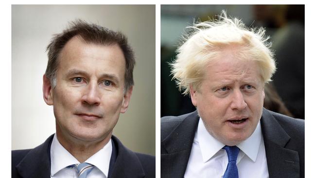 FILE - In this two photo file combo image, Jeremy Hunt, left, and Boris Johnson, right, who are the final two contenders for leadership of the Conservative Party, Thursday June 20, 2019. Following elimination votes Britain's Conservative Party members will vote for the final two contenders with the winner due to replace Prime Minister Theresa May as party leader and prime minister. (AP Photo FILE/Matt Dunham, Frank Augstein)