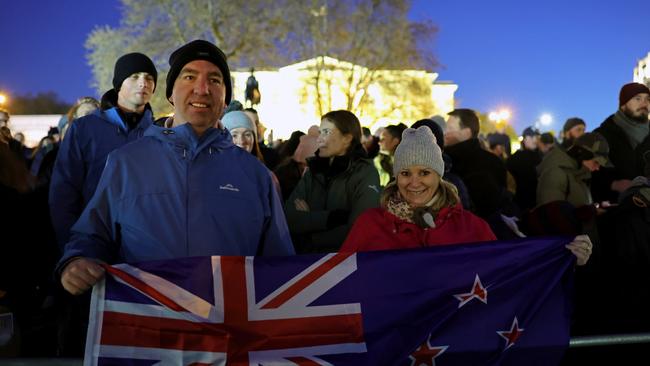 Members of the public with the New Zealand flag during the Dawn Service in London. Picture: Getty