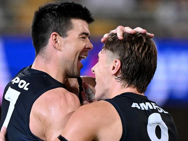 BRISBANE, AUSTRALIA - MARCH 08: Matthew Kennedy (L)of the Blues celebrates with team mate Lachie Fogarty of the Blues after kicking a goal during AFL Opening Round match between Brisbane Lions and Carlton Blues at The Gabba, on March 08, 2024, in Brisbane, Australia. (Photo by Bradley Kanaris/Getty Images)