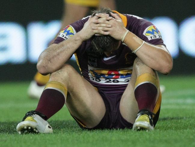 Brisbane Broncos vs Melbourne Storm SemiFinal at Suncorp Stadium - Broncos Ashton Sims sitting on the field with his head in his hands, disappointed with the loss.