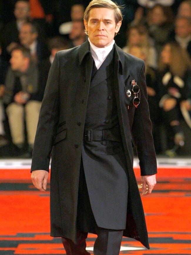 Willem Dafoe walking the Prada fall 2012 collection.