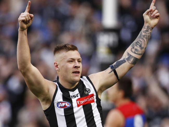 Jordan De Goey of the Magpies celebrates a goal during the Round 12 AFL match between the Collingwood Magpies and the Melbourne Demons at the MCG in Melbourne, Monday, June 10, 2019. (AAP Image/Daniel Pockett) NO ARCHIVING, EDITORIAL USE ONLY