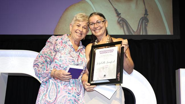 Women's Recognition Award winner Michelle Langford accepts her award from Cairns councillor Rhonda Coghlan. Picture: Brendan Radke