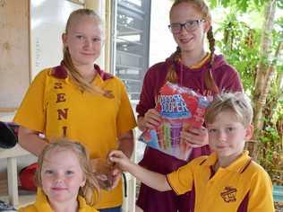 HELPING FELLOW STUDENTS: Biggenden State School Student Council's Sarsha Connolly and Emily Doyle selling iceblocks to Savana Kunde and Darcy Wright to help raise funds to provide meals, one day a week for Julia Creek State School students. Picture: Erica Murree