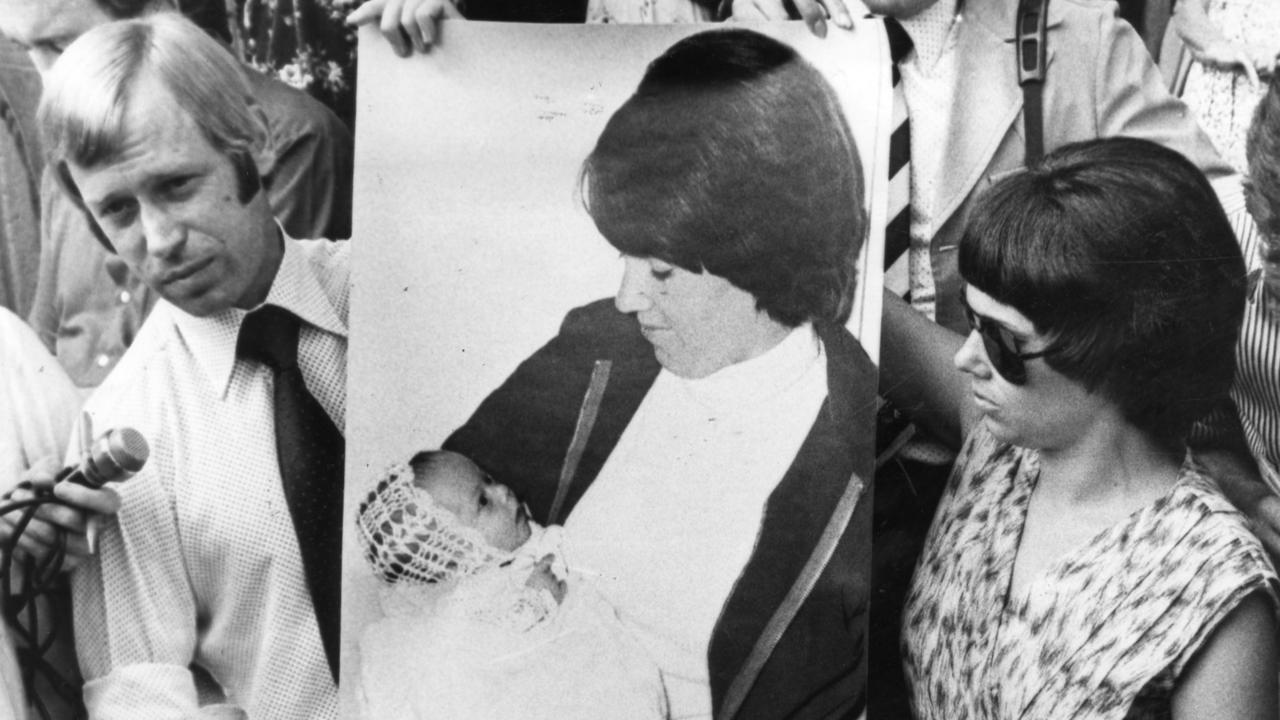 Michael and Lindy Chamberlain with a poster of Azaria Chamberlain taken four weeks before the baby's death. 