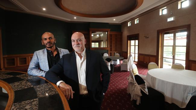 Aaron Gonzalves and selling agent Joseph Codianni inside the former Arundel Hills Country Club clubhouse. Picture Glenn Hampson