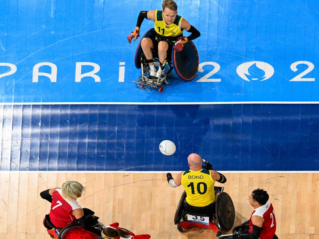 Australia's Beau Vernon, top, and Chris Bond, are captured competing against the Japanese in wheelchair rugby but the Aussies lost in heartbreaking fashion in overtime. They’ll now compete for bronze. Picture: Francois-Xavier Marit/AFP